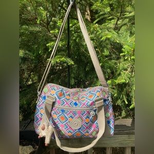 Kipling zippered satchel with carry handle and adjustable crossbody strap